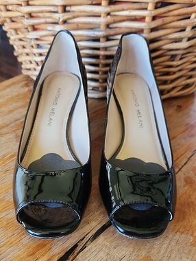 Black patten leather peep toe pumps